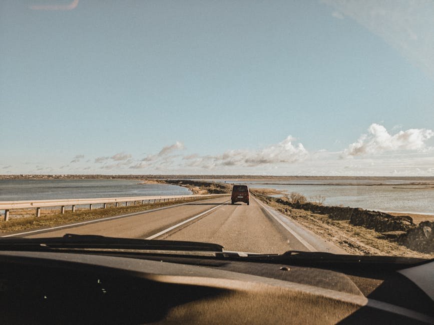 A serene drive along a coastal road in Odesa, capturing open skies and tranquil waters.