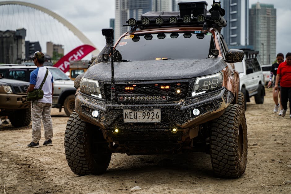 A lineup of rugged off-road vehicles gathers in Pasig City, showcasing adventure and exploration.